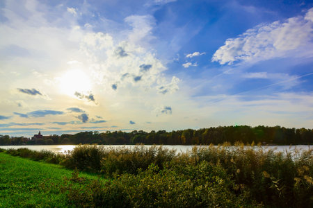 Nature with Lake Surrounded by Trees and Bushes in Autumn Time
