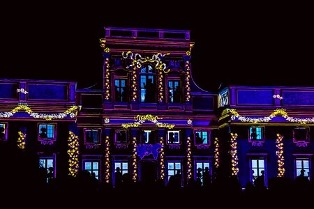 Facade of Palace or Old Building with people silhouettes. Video-Mapping show on the Facade of Wilanow Palaceの写真素材