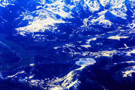 Rocky Mountain Aerial View with Snow on Top or Peak from Jetの写真素材