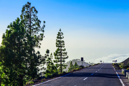 Landscape with Asphalt Road and Mountains with Sky on Tenerife Island at Dayの写真素材