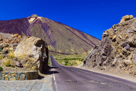 Landscape with Asphalt Road and Mountains with Sky on Canary Island at Dayの写真素材
