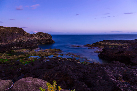 Stone Coast of Atlantic Ocean on Tenerife Canary Island at Eveningの写真素材