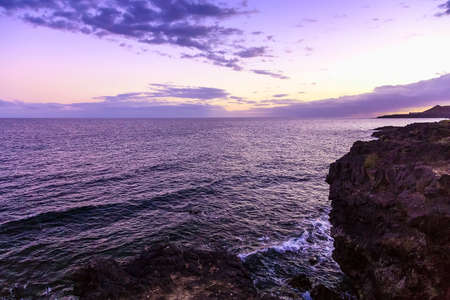 Stone Coast of Atlantic Ocean on Tenerife Island in Spain at Eveningの写真素材