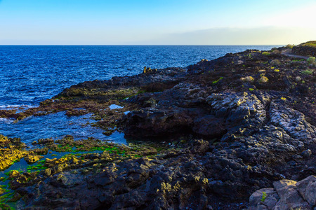 Stone Coast of Atlantic Ocean with Waves on Canary Island at Dayの写真素材