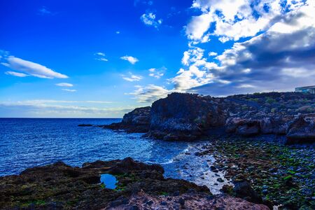 Stone Beach of Atlantic Ocean with Waves on Canary Island at Dayの写真素材