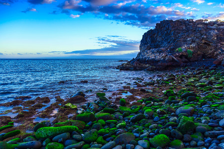 Stone Coast of Atlantic Ocean with Waves on Tenerife Island in Spainの写真素材