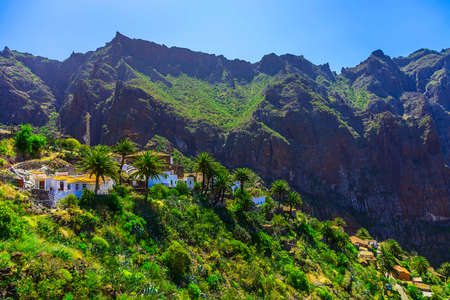 Small Village and Buildings in Green Mountains Landscape on Tenerife Canary Island in Spain at Dayの写真素材