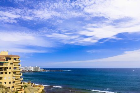 Coast or Shore of Atlantic Ocean with Buildings Landscape on Canary Island in Spain at Dayのeditorial素材