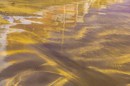 Abstract Background with Sand and Building Reflection in Waterの写真素材