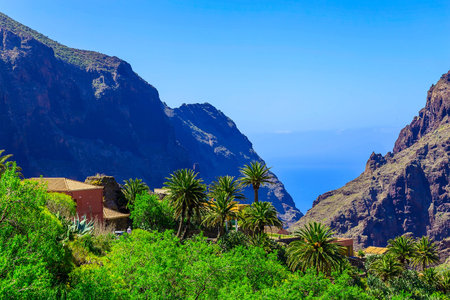 Small Village and Buildings in Green Mountains Landscape on Tenerife Islandの写真素材
