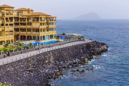 Rock Coast or Shore of Atlantic Ocean with Buildings Seascape on Tenerife Islandのeditorial素材