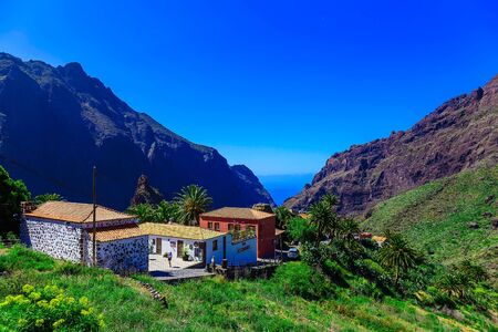 Small Village and Buildings in Green Mountains Landscape on Canary Island in Spain at Dayのeditorial素材