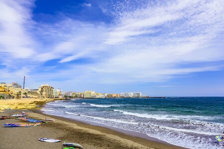 Sand Beach Coast or Shore of Atlantic Ocean with Buildings Seascape on Tenerife Island in Spain at Dayの写真素材