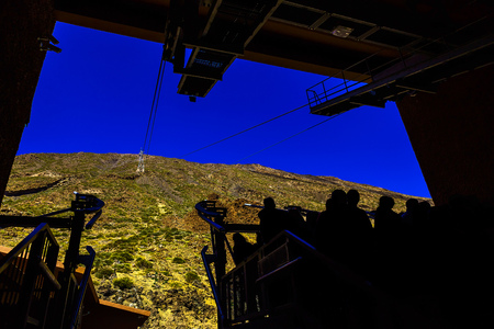 View to Cableway or Funicular with People Silhouettes looking on Mountain on Teide National Park on Tenerife Canary Island in Spainの写真素材