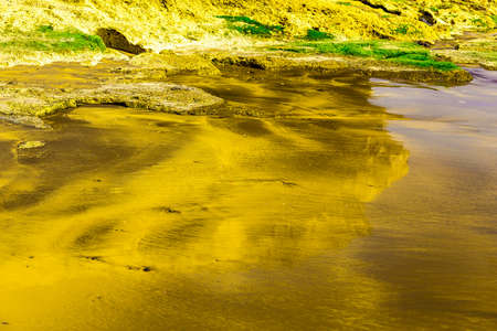Yellow Sand Natural Abstract Background with Reflection in Waterの写真素材