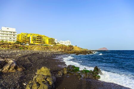 Rock Coast or Shore of Atlantic Ocean with Buildings Seascape on Tenerife Canary Island in Spainのeditorial素材