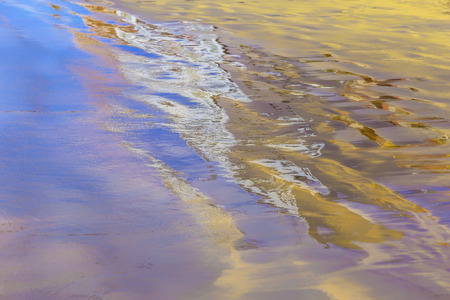 Abstract Background with Sand and Building Reflection in Waterの写真素材