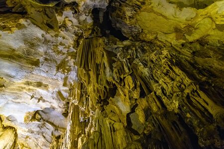 Cave texture background with Stalactite and Stalagmite Formations in the Dim Cave in Alanya, Turkeyの写真素材