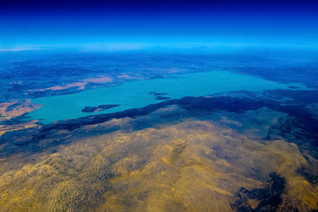 Airplane view on mountain with lake from aboveの写真素材