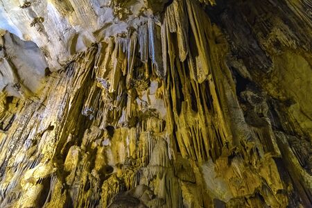 Cave texture background with Stalactite and Stalagmite Formations in the Dim Cave in Alanya, Turkeyの写真素材