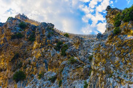 Part of fortress on rocky coast of Alanya on background of sky, Turkeyの写真素材