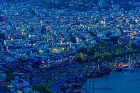 View of city and harbor in the evening in Alanya, Turkeyの写真素材