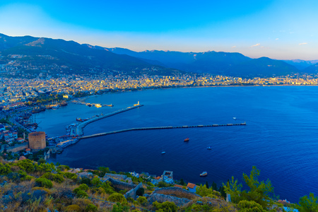 Aerial view on Red Tower (Kizil Kule) and harbor from Citadel of Alanya at sundown, Turkeyの写真素材