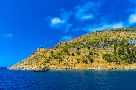 View on ancient Alanya fortress on mountain from seaside at sunny day, Turkeyのeditorial素材