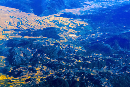 Airplane view on mountain from aboveの写真素材