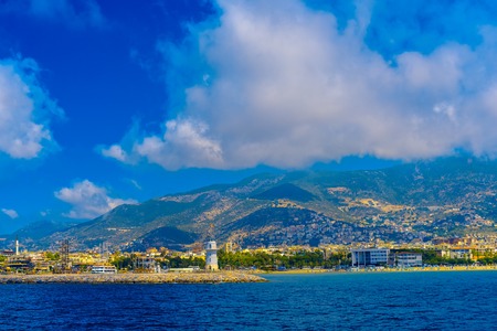 View of Alanya's city and port with the lighthouse at sunset, Turkeyの写真素材