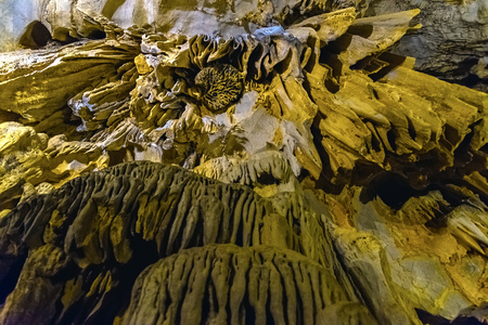 Cave texture background with Stalactite and Stalagmite Formations in the Dim Cave in Alanya, Turkeyの写真素材