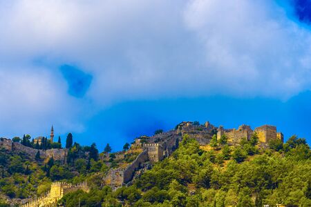 Ancient Castle and mosque on top of mountains in Alanya, Turkeyの写真素材