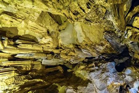 Cave texture background with Stalactite and Stalagmite Formations in the Dim Cave in Alanya, Turkeyの写真素材