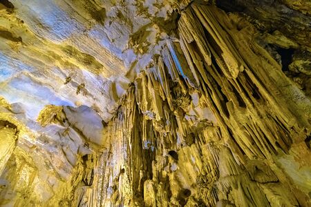 Cave texture background with Stalactite and Stalagmite Formations in the Dim Cave in Alanya, Turkeyの写真素材