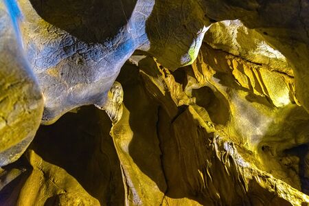 Cave texture background with Stalactite and Stalagmite Formations in the Dim Cave in Alanya, Turkeyの写真素材