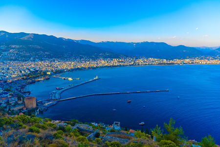 Aerial view on Red Tower (Kizil Kule) and harbor from Citadel of Alanya at sunset, Turkeyの写真素材