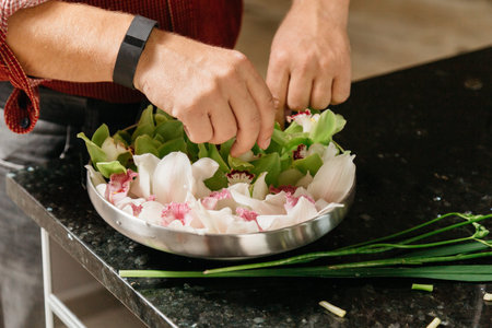 Man making flowers arrangment orchidsの写真素材
