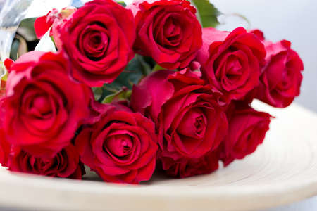 Bouquet of red roses on plateの写真素材
