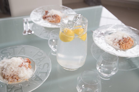 lunch table at home with lemonade and pasta bolognese