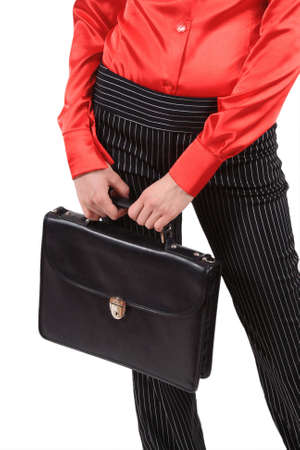 The girl in a red shirt costs with a portfolio in handsの写真素材