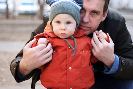 The daddy with the small son on walk in the springの写真素材