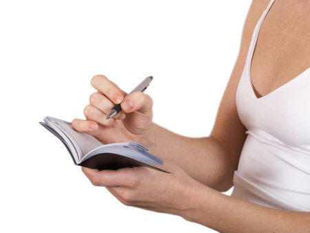 The girl in a white shirt costs with a portfolio in hands  