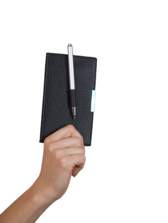 The female hand holds a small notebook on a white background           