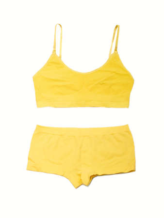 Yellow lingerie on the white backgroundの写真素材