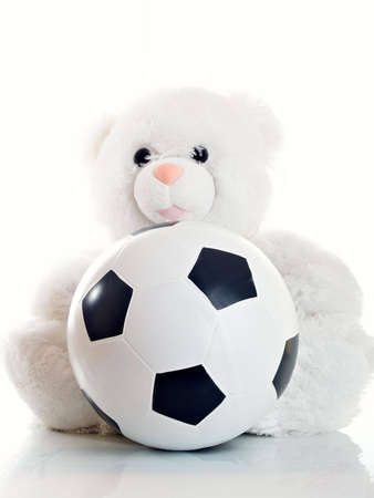 Soft toy white ìåäâåòü with a ballの写真素材