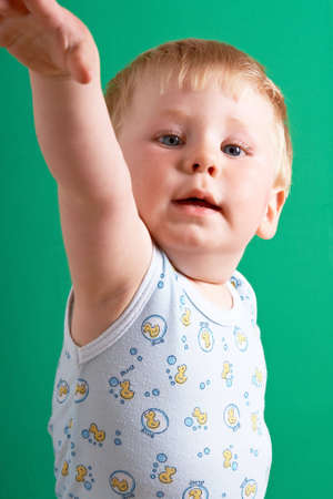 Portrait of the blond little boy on a backgroundの写真素材