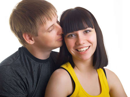 Portrait of young happy pair on a white backgroundの写真素材