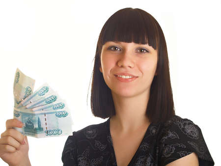 The young girl holds in hands Russian money for a white backgroundの写真素材