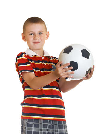 young boy holding football in his handの写真素材