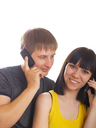 The young couple call by a mobile phoneの写真素材